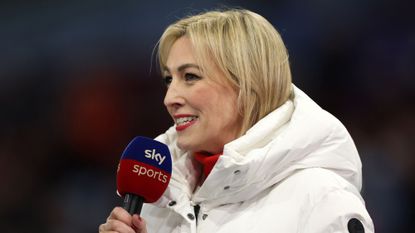 Kelly Cates speaking into a Sky Sports microphone