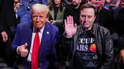 Donald Trump and Elon Musk pose for a photo at Madison Square Garden event