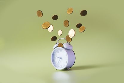 Coins and clock on a green background