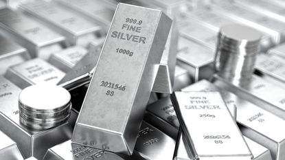 Stock photo of fine silver bars with silver coins