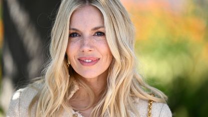 sienna miller on a green and white background