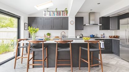 Light-filled kitchen extension with rooflights, grey units, and island seating 