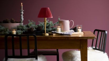 Wooden table with garland and pooky lamp