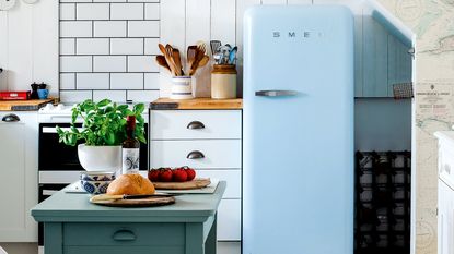 Kitchen with blue Smeg fridge freezer