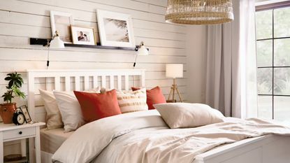 Neutral bedding and cushions in a neutral bedroom