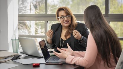 A financial adviser advises another woman.