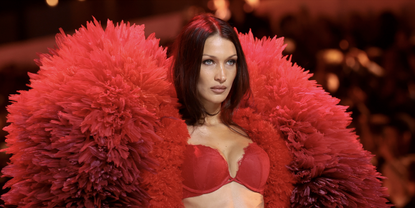 Bella Hadid walks the runway for the Victoria&#039;s Secret Fashion Show 2024 on October 15, 2024 in New York City in a red bra