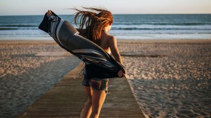 best sea salt sprays - Woman with long hair on the beach