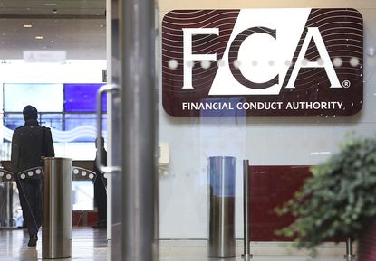 A logo sits on display in the headquarters of the Financial Conduct Authority (FCA) in the Canary Wharf business district in London