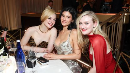 Kylie Jenner sits with Elle Fanning and Dakota Fanning at the 2025 Golden Globes