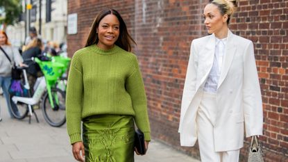 two women wearing monochromatic outfits london street style