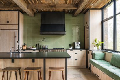 light wood kitchen with sage backsplash tiles