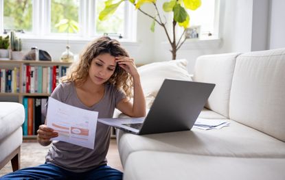 Woman reads energy bill