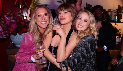 Taylor Swift attends her 35th birthday party with friends wearing a black Balmain dress and diamond drip earrings