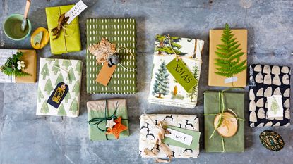 Selection of gardeners&#039; gifts beautifully wrapped and laid out on tabletop