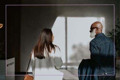 Conceptual image of a man and a woman standing next to each other, and walking away from the camera.