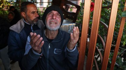 A man mourns the death of displaced Palestinians killed in Mawasi Khan Yunis