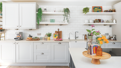 silver coffee machine in white modern kitchen