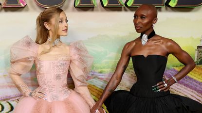 Ariana Grande in a pink Glinda inspired gown and Cynthia Erivo in a sleek black Elphaba look at an event celebrating the Australian premiere of &#039;Wicked&#039; in Sydney.