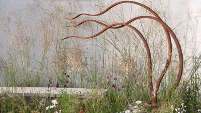 Unusual bronze garden sculpture, in the mornflake garden designed by Janine Crimmins awarded Gold and Best Show Garden Tatton Park RHS flower show 2012