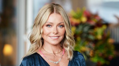 kelly ripa on a neutral background