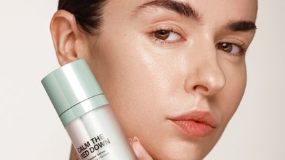 girl holding calm the red down innbeauty project serum