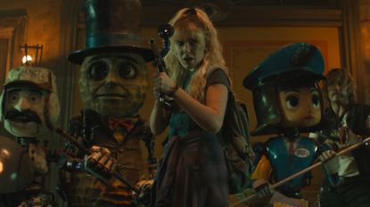 millie bobby brown and a team of robots wield weapons in a still from the movie the action state