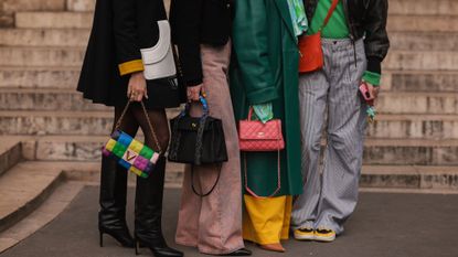 A group of women holding investment handbags