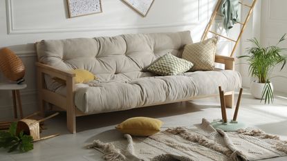 A living room looks disheveled after an earthquake.