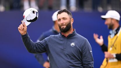 Jon Rahm tips his cap to the crowd at the 2024 Open