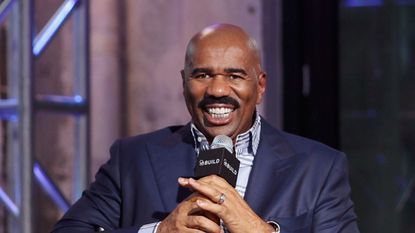 steve harvey on a neutral background