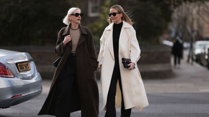 two women wearing monochromatic outfits london street style