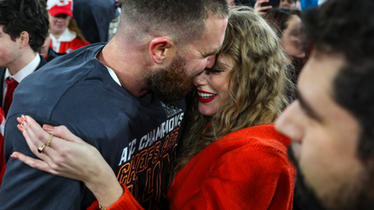 Travis Kelce #87 of the Kansas City Chiefs (L) celebrates with Taylor Swift after defeating the Baltimore Ravens in the AFC Championship Game at M&amp;T Bank Stadium on January 28, 2024 in Baltimore, Maryland.