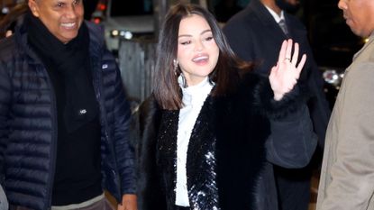 Selena Gomez entering a show taping in a sequin and fur jacket