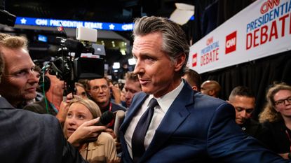 California Gov. Gavin Newsom (D) speaks to reporters during the Biden/Trump presidential debate. 