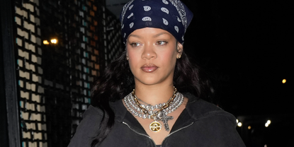 Rihanna is seen on December 29, 2024 in New York City wearing a fur hat and bottega veneta boots