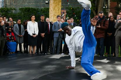 Danis Civil aka France&#039;s B-boy Dany Dann performs in front of France&#039;s Minister for Sports and Olympics Amelie Oudea-Castera (C-2L), French President of the Paris 2024 Olympics and Paralympics Organising Committee (Cojo) Tony Estanguet (C-L) and French Prime Minister Gabriel Attal (C) during the Olympics Flag Tour at the Hotel de Matignon in Paris on April 25, 2024.