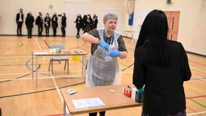 Pupils at a school in Halifax line up for lateral flow tests 