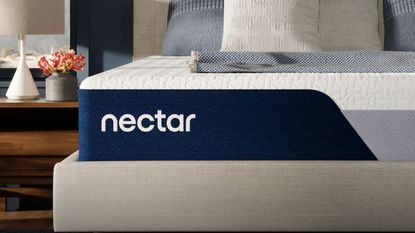 Corner of the Nectar Memory Foam Mattress beside a nightstand,