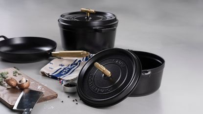 Staub x Buster and Punch brass cast iron set being used