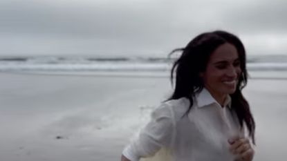 meghan markle running on a beach