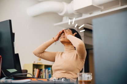 Woman sitting in an office, tired after not having enough sleep