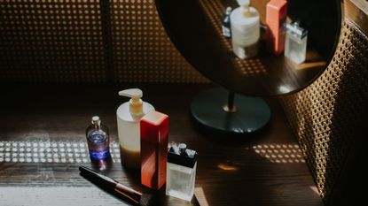 Line up of skincare products on dressing table