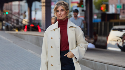 woman wearing turtleneck, collared jacket, and skirt 