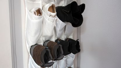 Over-the-door shoe organizer on a wooden door