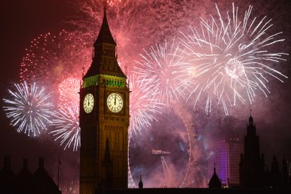 Fireworks surround Big Ben at midnight on New Years Eve