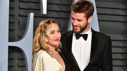 Miley Cyrus and Liam Hemsworth attend the 2018 Vanity Fair Oscar Party