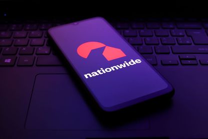 The Nationwide Building Society logo appears on the screen of a smartphone