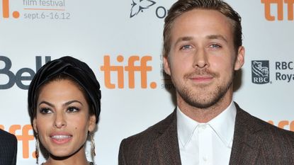 Eva Mendes poses on the red carpet with Ryan Gosling