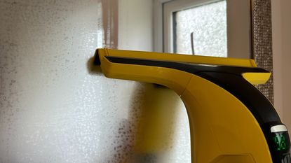 Karcher WV6 Plus N window vac being used on steamy bathroom mirror